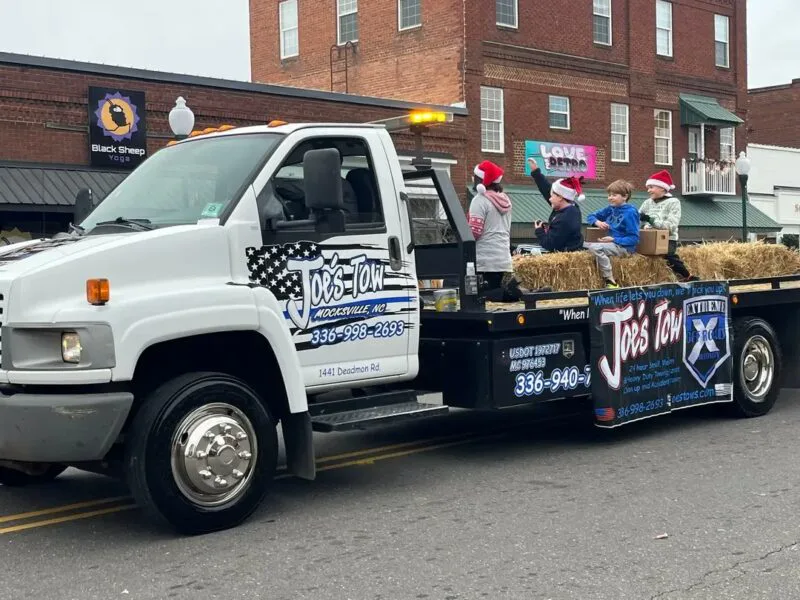 Joe’s Tow truck participating in a Mocksville community parade